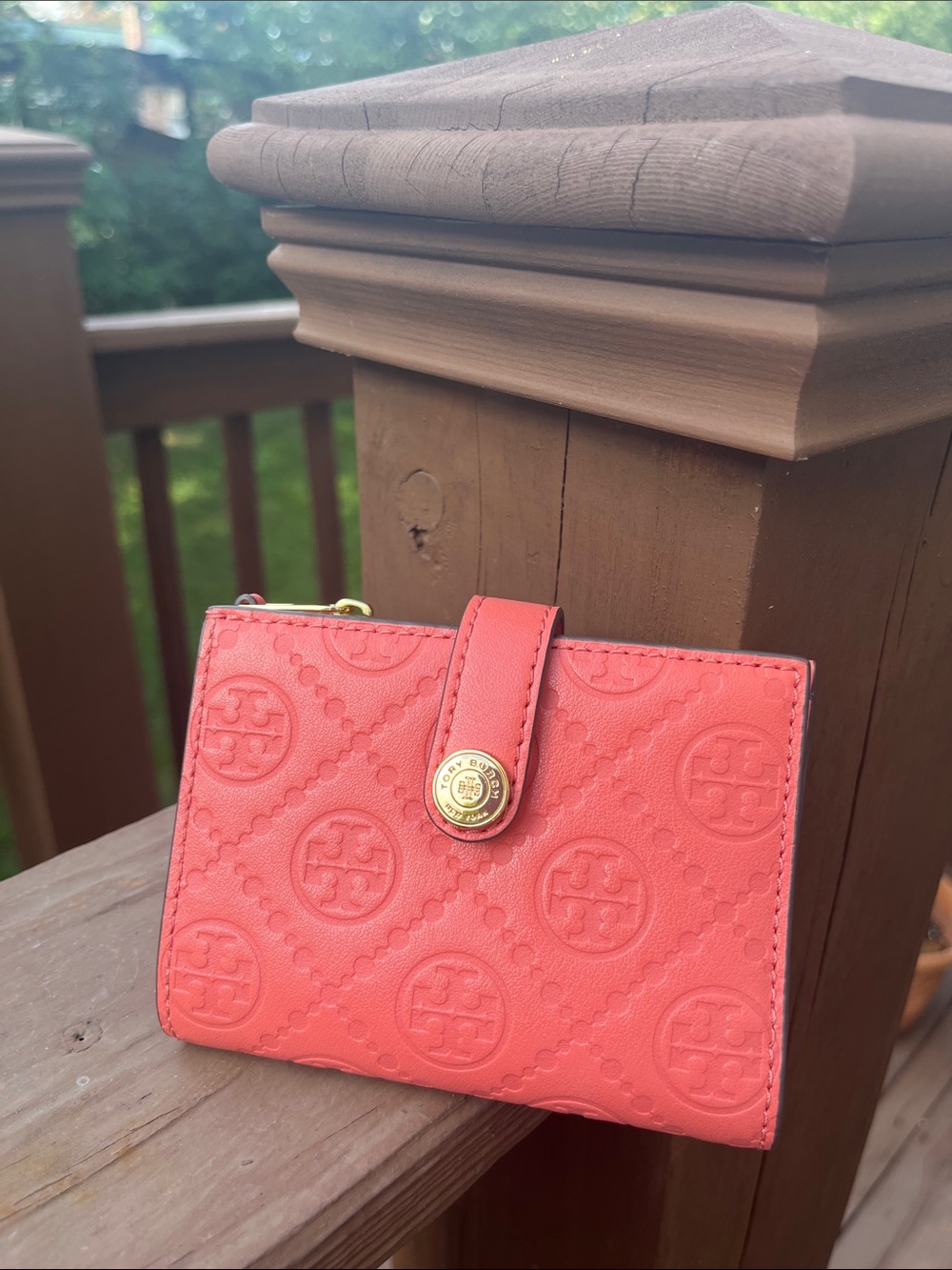 Pristine condition! Tory Burch T monogram embossed leather bi-fold wallet.